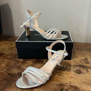 Women’s silver sandal heels, size 7.5M